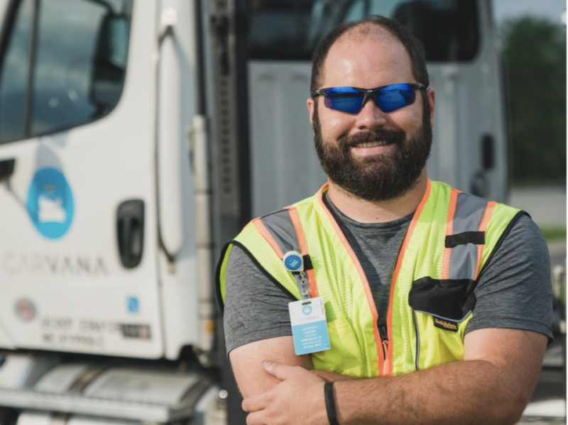 employee in front of transport vehicle