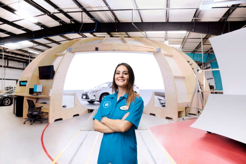 female employee in front of photo dome